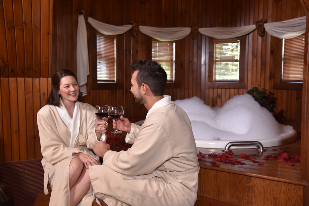 Romantic Getaways in Pennsylvania, photo of a happy couple relaxing in a grand suite